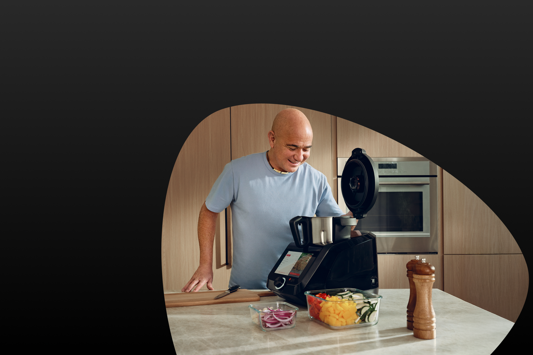 Andre Agassi met een Monsieur Quisine